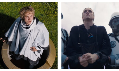 Stills of Joseph Zada in The Hunger Games: Sunrise on the Reaping, on the left he's in a white poncho rising from a pedestal onto grass and on the right he is in handcuffs, flanked by guards in white armour.