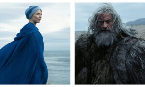 A side-by-side composite from the film 'The Death of Robin Hood'. On the left, Jodie Comer stands in profile wearing a vibrant blue hooded cloak and matching head covering, gazing out over a grey, overcast sea. On the right, a tight close-up reveals Hugh Jackman as a weathered Robin Hood with long, dishevelled grey hair, a thick beard, and facial scars, staring forward in a rugged fur cloak.