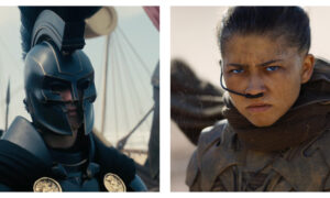 A side-by-side comparison of two film stills from book adaptations. On the left, Benny Safdie’s Agamemnon from The Odyssey wears a dark, ornate Greek-style hoplite helmet with a crest and a black cloak fastened by gold lion emblems. On the right, a close-up of Zendaya’s Chani from Dune: Part Three with bright blue eyes, sports a serious expression, a facial scar, and a nose tube, wearing brown desert gear against a sandy backdrop.